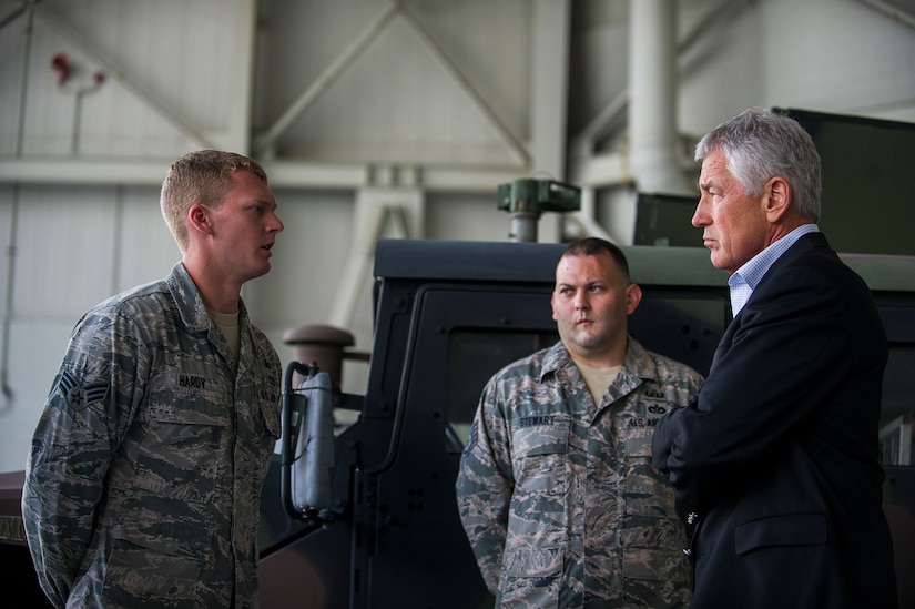 Senior Airman Robert Hardy, 628th Civil Engineer Squadron explosive ordinance disposal technician, briefs Secretary of Defense Chuck Hagel on EOD operations July 17, 2013, during a demonstration at Joint Base Charleston- Air Base, S.C. Hagel is the 24th Secretary of Defense and the first enlisted combat veteran to lead the Department of Defense. Hagel’s visit to JB Charleston included briefings on flying and support operations conducted by the Air Force in Charleston, meeting with Boeing representatives about the company’s involvement with the Air Force, and conducting a town hall meeting with Department of Defense civilian employees to discuss the federal government’s sequestration and civilian work furloughs. (U.S. Air Force photo/ Senior Airman George Goslin)