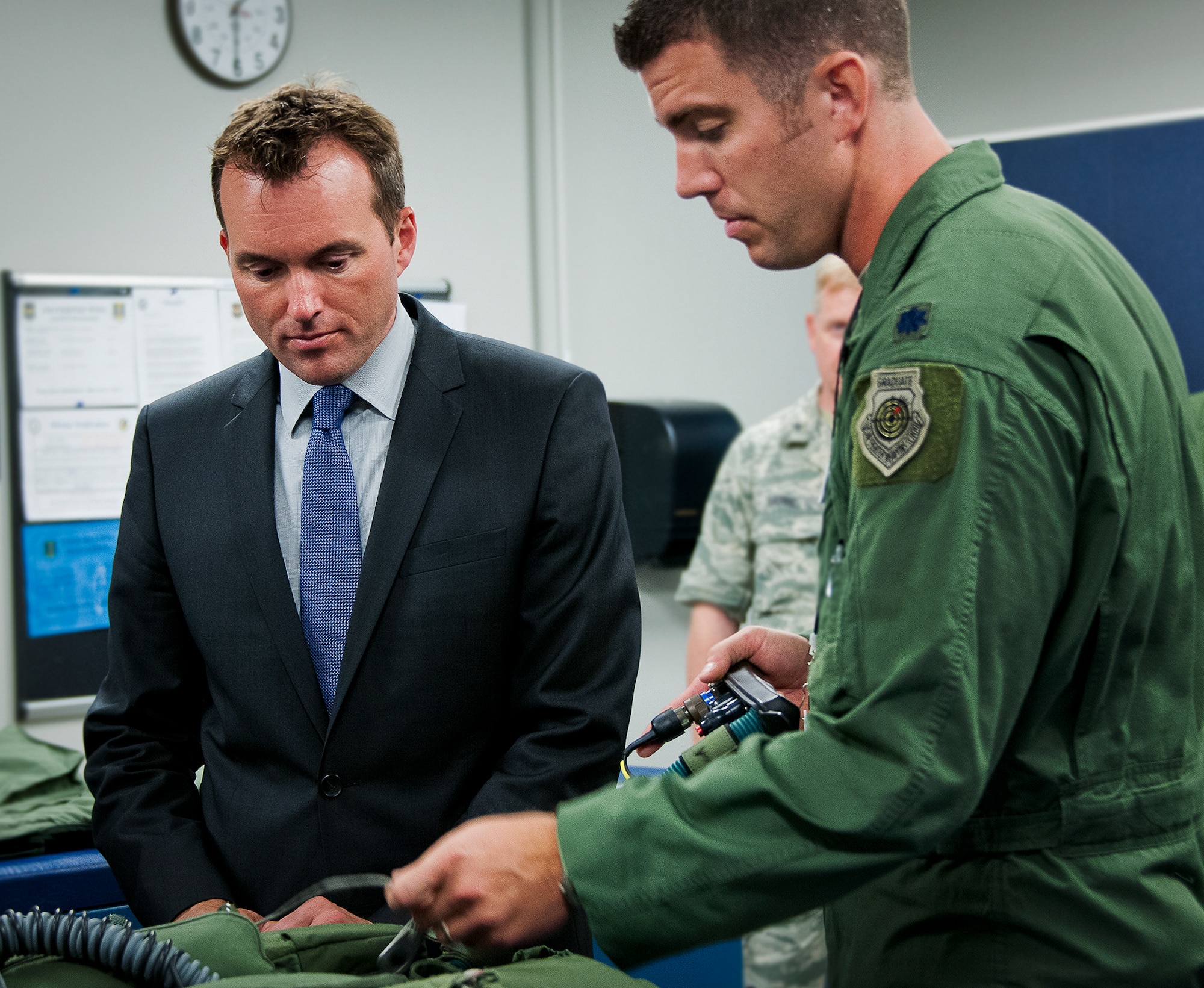 Acting Secretary of the Air Force Eric Fanning listens to Lt. Col. Matthew Renbarger, 58th Fighter Squadron commander, talk about the innovations incorporated in the new F-35 Lightning II flight suit at Eglin Air Force Base, Fla., July 16.  Fanning spent the day on the base learning about the diverse joint and Air Force missions that take place each day from range testing to explosive ordnance disposal training to F-35 operations.  (U.S. Air Force photo/Samuel King Jr.) 