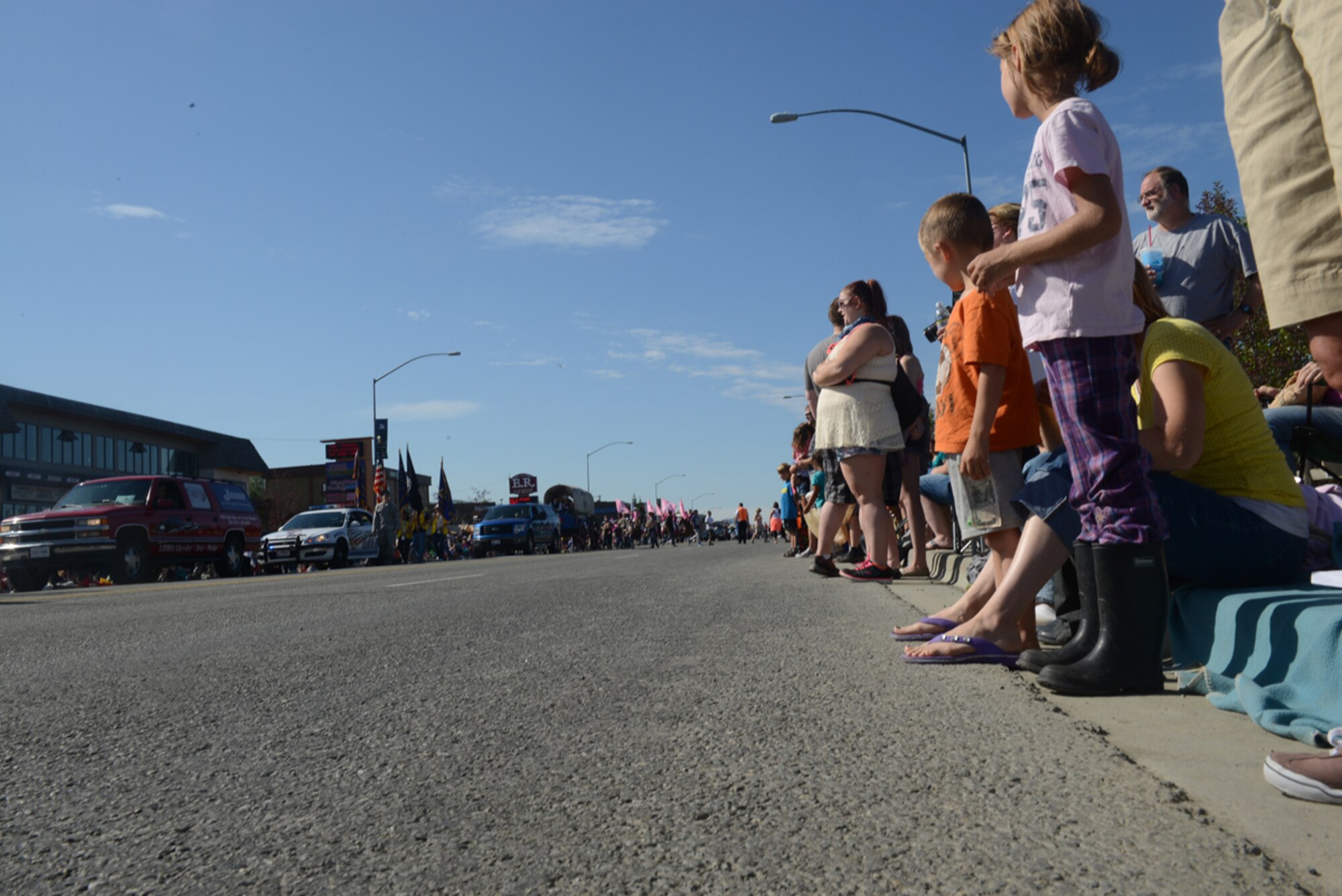 JOINT BASE ELMENDORF-RICHARDSON, Alaska - Thousands of spectators line the streets to watch the 28th annual Bear Paw Parade in Eagle River, Alaska, July 13. The parade is a part of the five-day Bear Paw Festival, which is hosted every year by the Chugiak-Eagle River Chamber of Commerce. Joint Base Elmendorf-Richardson's 673d Security Forces Squadron and Joint Base Against Drunk Driving program members were featured in the parade. (U.S. Air Force photo/Airman Ty-Rico Lea)