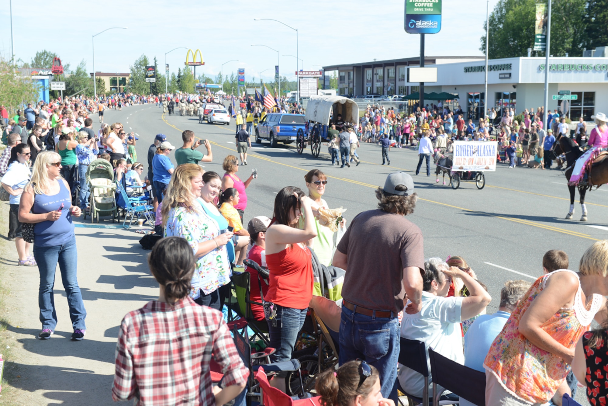 JOINT BASE ELMENDORF-RICHARDSON, Alaska - Thousands of spectators line the streets to watch the 28th annual Bear Paw Parade in Eagle River, Alaska, July 13. The parade is a part of the five-day Bear Paw Festival, which is hosted every year by the Chugiak-Eagle River Chamber of Commerce. Joint Base Elmendorf-Richardson's 673d Security Forces Squadron and Joint Base Against Drunk Driving program members were featured in the parade. (U.S. Air Force photo/Airman Ty-Rico Lea)