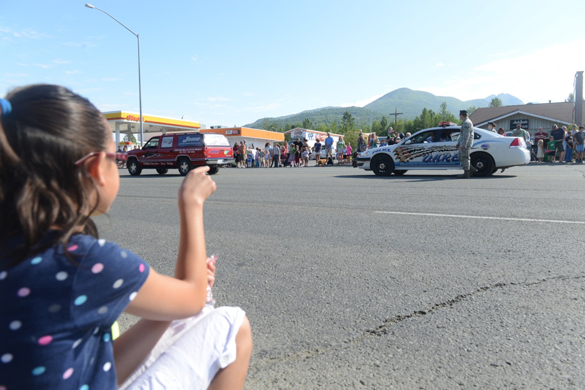 JOINT BASE ELMENDORF-RICHARDSON, Alaska - Thousands of spectators line the streets to watch the 28th annual Bear Paw Parade in Eagle River, Alaska, July 13. The parade is a part of the five-day Bear Paw Festival, which is hosted every year by the Chugiak-Eagle River Chamber of Commerce. Joint Base Elmendorf-Richardson's 673d Security Forces Squadron and Joint Base Against Drunk Driving program members were featured in the parade. (U.S. Air Force photo/Airman Ty-Rico Lea)