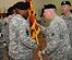 From left, U.S. Army Col. Jason Vick, incoming 597th Transportation Brigade commander, accepts the unit guidon from U.S. Army Maj. Gen. Thomas Richardson, Military Surface Deployment and Distribution Command commanding general, as he assumes command during the unit's change of command ceremony at Fort Eustis, Va., July 17, 2013. Vick assumed command of the unit from U.S. Army Col. Charles Brown. (U.S. Air Force photo by Staff Sgt. Wesley Farnsworth/Released)

