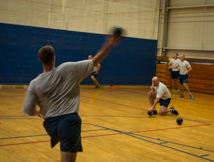 An Airman prepares to throw a foam ball at an opponent during the Commanders Dodgeball Challenge July 12, 2013, at the Fitness Center at Joint Base Charleston - Air Base, S.C. The monthly Commanders Challenge is a Wing initiative intended to encourage resident interaction and camaraderie as part of Comprehensive Airman Fitness. (U.S. Air Force photo/Senior Airman Dennis Sloan)