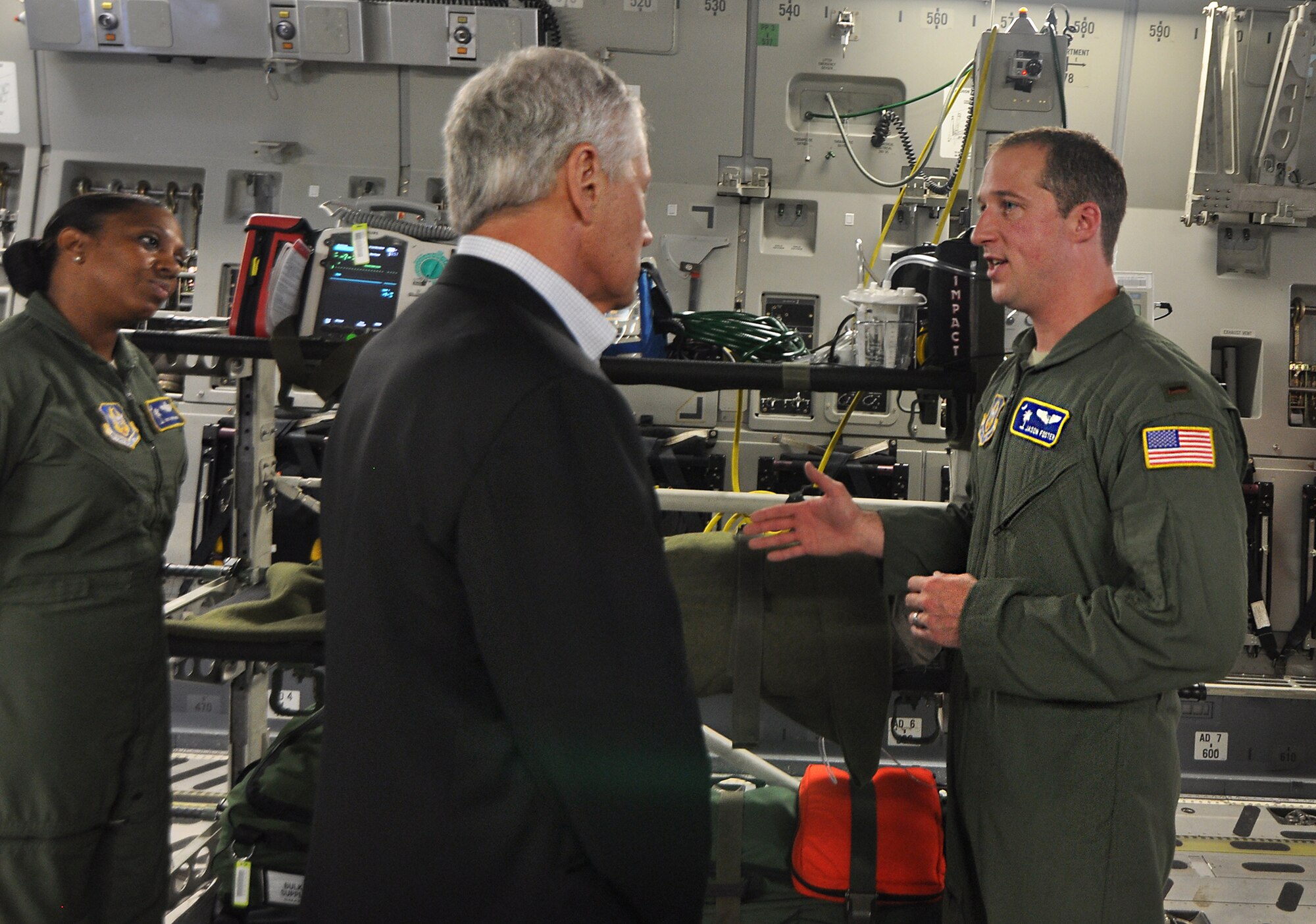 2nd Lt. Jason Foster, 315th Aeromedical Evacuation Squadron, tells Secretary of Defense Chuck Hagel about the AE mission, aboard a  C-17 Globemaster III parked on the Joint Base Charleston, S.C. flightline July 17, 2013. The Secretary visited Joint Base Charleston as part of his Southeast United States military base tour. (Air Force Reserve photo by Michael Dukes)