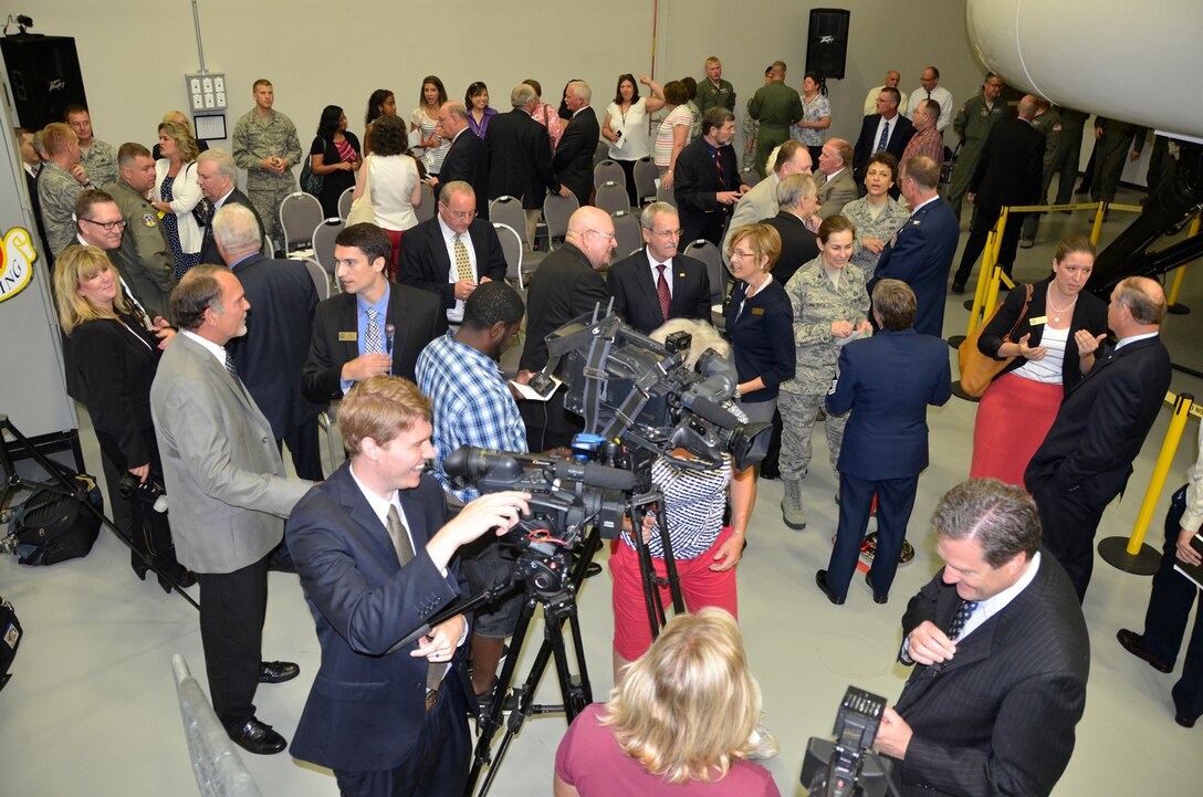 WRIGHT-PATTERSON AIR FORCE BASE, Ohio – Base and local community leaders participated in a ribbon cutting ceremony July 16 celebrating the official opening of a new C-17 Simulator Training Facility here. The facility includes a new and fully networked C-17 weapon system trainer, a training management system, computer-based training devices, a core integrated processor task trainer and portable flight-planning devices. It also has the ability to be networked with other U.S. Air Force WST devices around the world for cross-team mission training. Having the C-17 simulator here will save the wing approximately $1 million a year because the 120 pilots and loadmasters assigned to the wing can do their annual and refresher training here instead of traveling to other bases. (U.S. Air Force photo/Master Sgt. Charlie Miller)