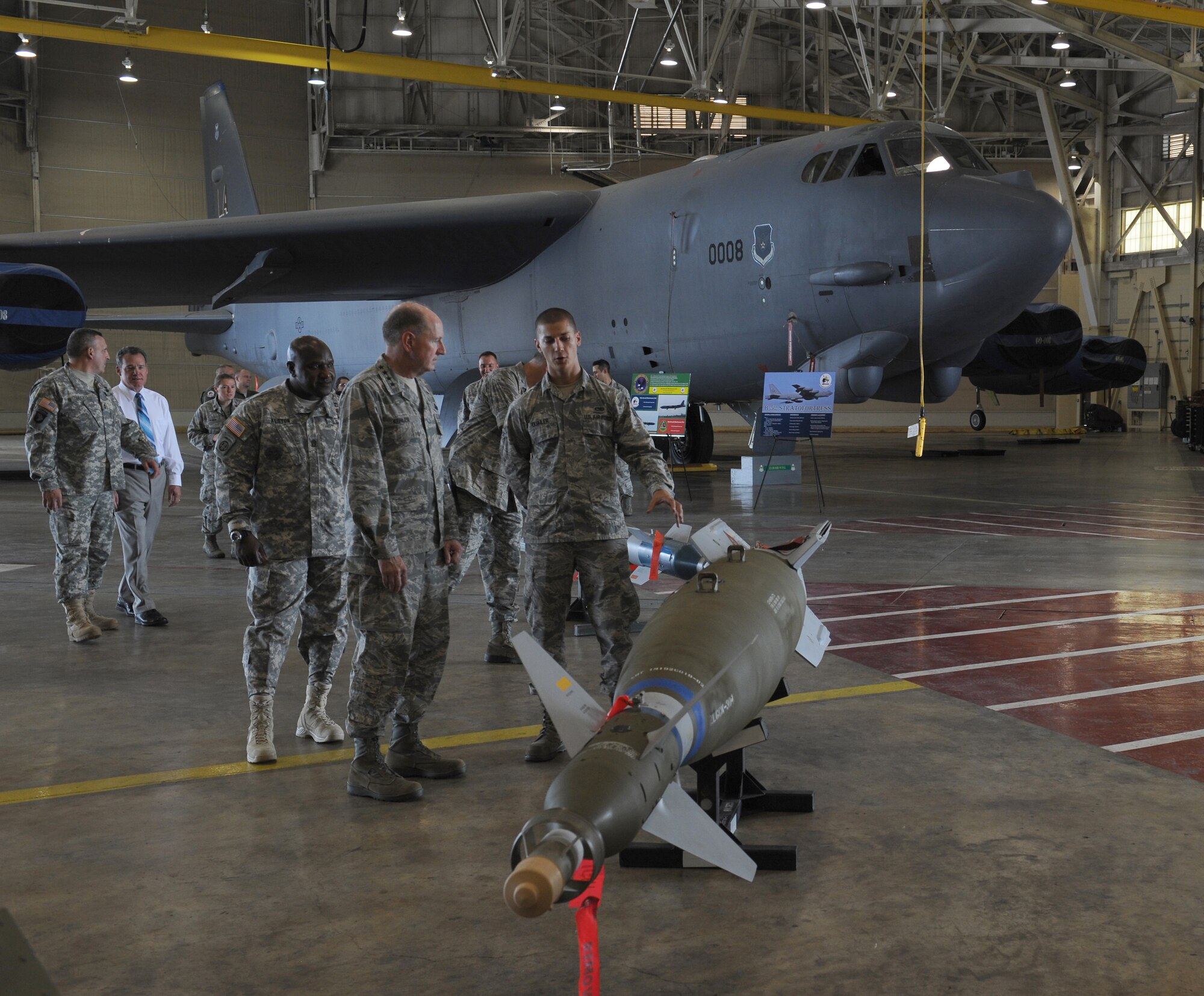 Senior Airman Gregory Quailer, 2nd Munitions Squadron, speaks to Gen. C. Robert Kehler, United States Strategic Command commander, about GBU-10 laser-guided bombs, which are used on the B-52H Stratofortress on Barksdale Air Force Base, La., July 15, 2013. Kehler met with 2nd Bomb Wing Airmen to discuss the longevity and versatility of the B-52. (U.S. Air Force photo/Airman 1st Class Benjamin Gonsier)
