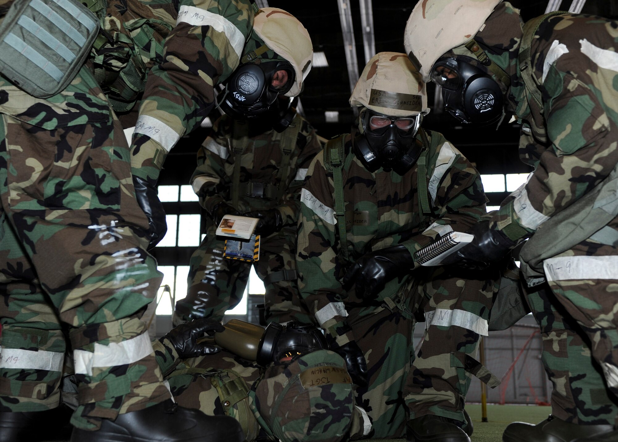 Airmen from the 28th Operations Support Squadron perform self-aid and buddy care during the Phase II portion of an operational readiness exercise at Ellsworth Air Force Base, S.D., July 10, 2013. OREs are designed to train Airmen how to solve and operate in a deployed environment. (U.S. Air Force photo by Airman 1st Class Anania Tekurio/Released)