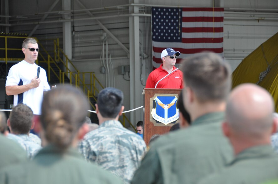 Col. Craig C. Peters, 911th Airlift Wing commander, speaks to wing members and their families as part of the opening ceremony for Family Day, July 13, 2013, at the Pittsburgh International Airport Air Reserve Station.  During the opening, Col. Peters, along with Capt. Shawn M. Walleck, event emcee, introduced a ‘Parade of Stars,’ similar to a Yellow Ribbon event.  The Parade of Stars includes organizations such as the Key Spouse, Psychological Health and Advocacy, Airman and Family Readiness, and Sexual Assault and Response to educate & provide members and their families an avenue for assistance when needed. (U.S. Air Force photo by Senior Airman Joseph E. Bridge)