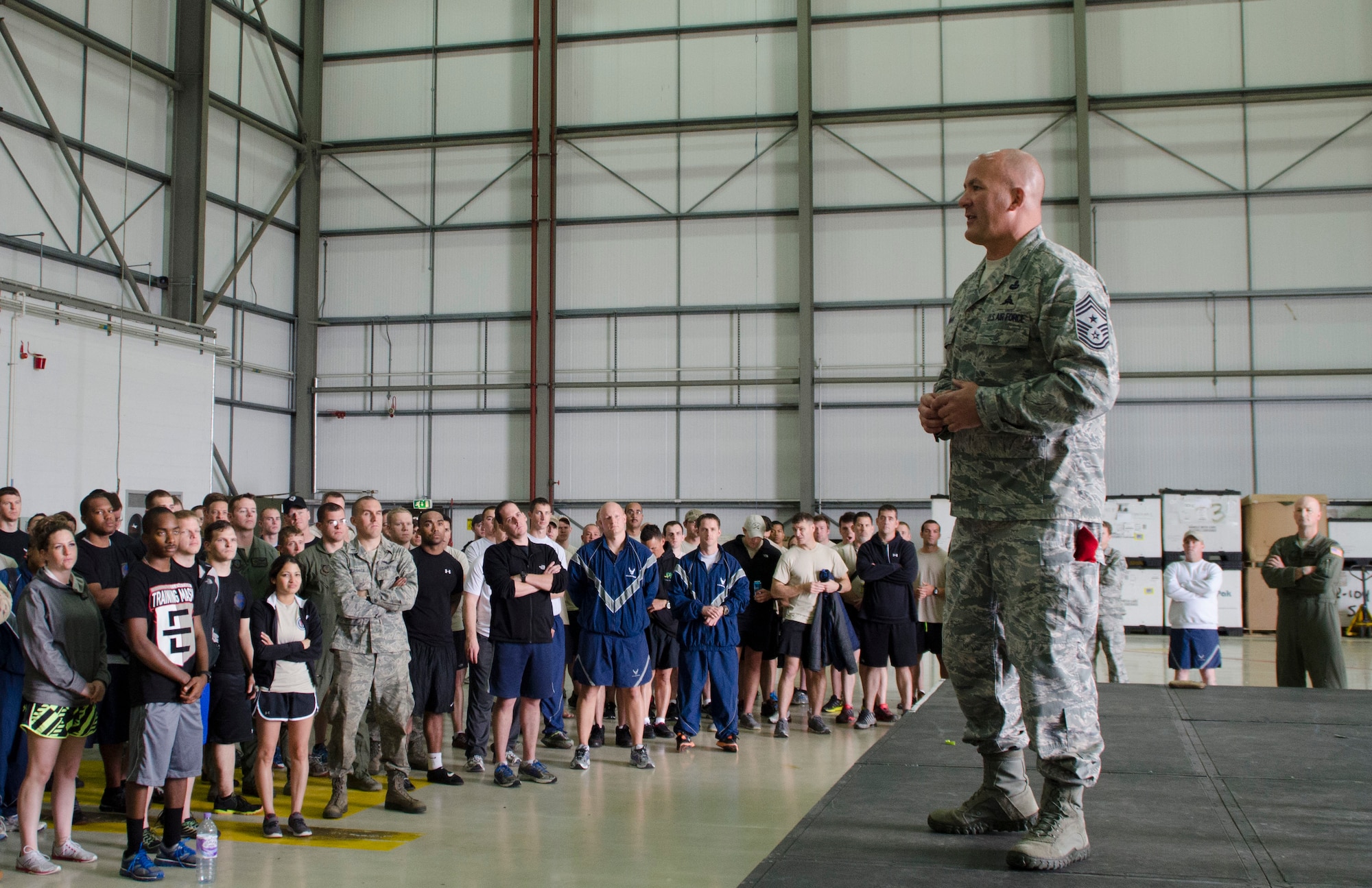 Chief Master Sgt. William Markham, 352nd Special Operations Group command chief, addresses Team Mildenhall members during the 352nd SOG Olympics closing ceremony on RAF Mildenhall, England, July 3, 2013. The 352nd Special Operations Maintenance Squadron won the 352nd SOG Olympics and was awarded the “SOG Hog.” The 352nd SOG Olympics is designed to foster teamwork and unity of action among approximately 1,000 members of the 352nd SOG. (U.S. Air Force photo by Staff Sgt. Stephen Linch/Released)