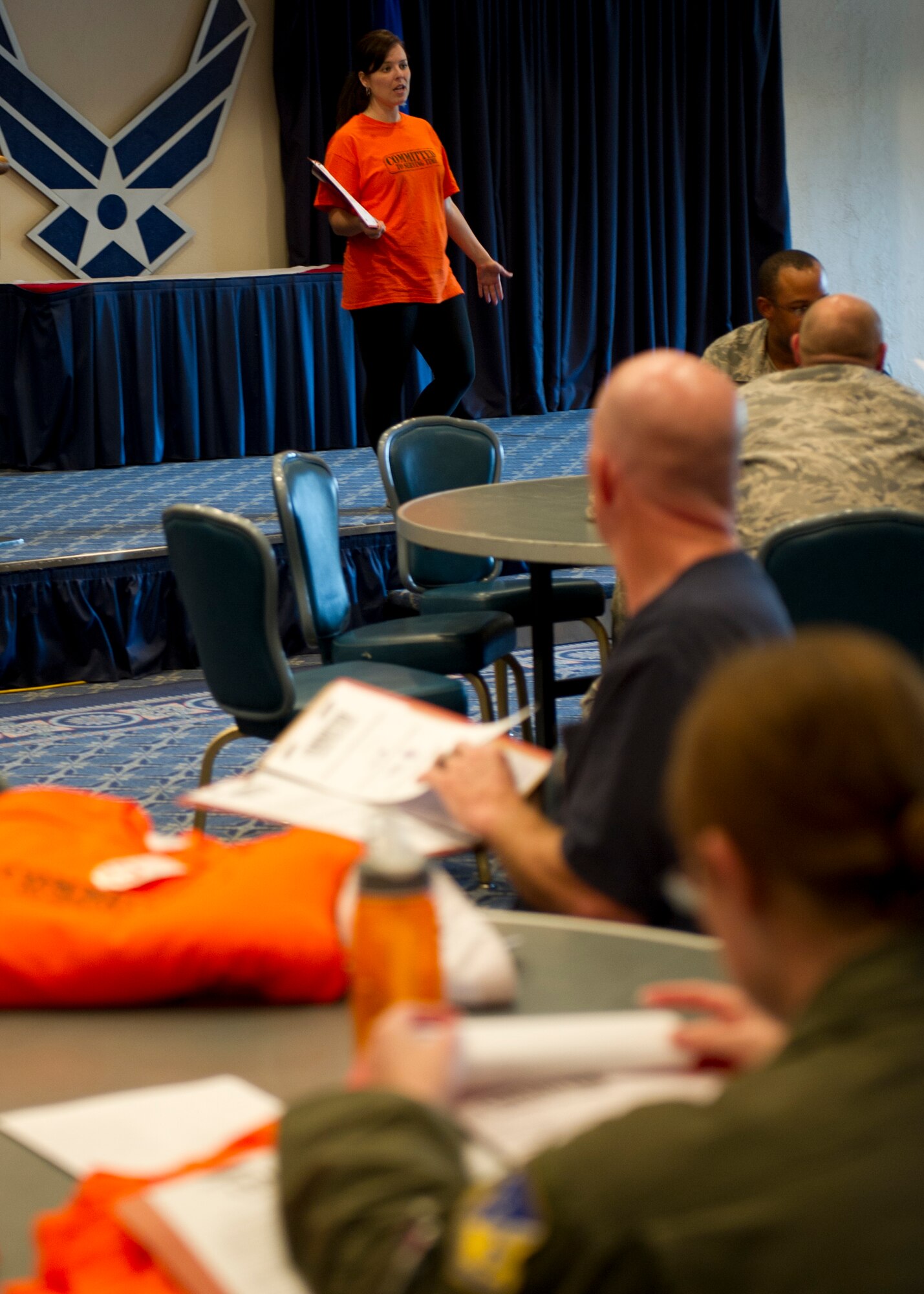 Amanda Gallagher, 49th Force Support Squadron marketing director, explains the rules for this year’s Big Give season six during the kick-off at Holloman Air Force Base, N.M., July 12. Their packets contained work logs, contact information, and contest rules This year’s Big Give theme is “Committed to Serving Time.” (U.S. Air Force photo by Senior Airman Kasey Close/Released)