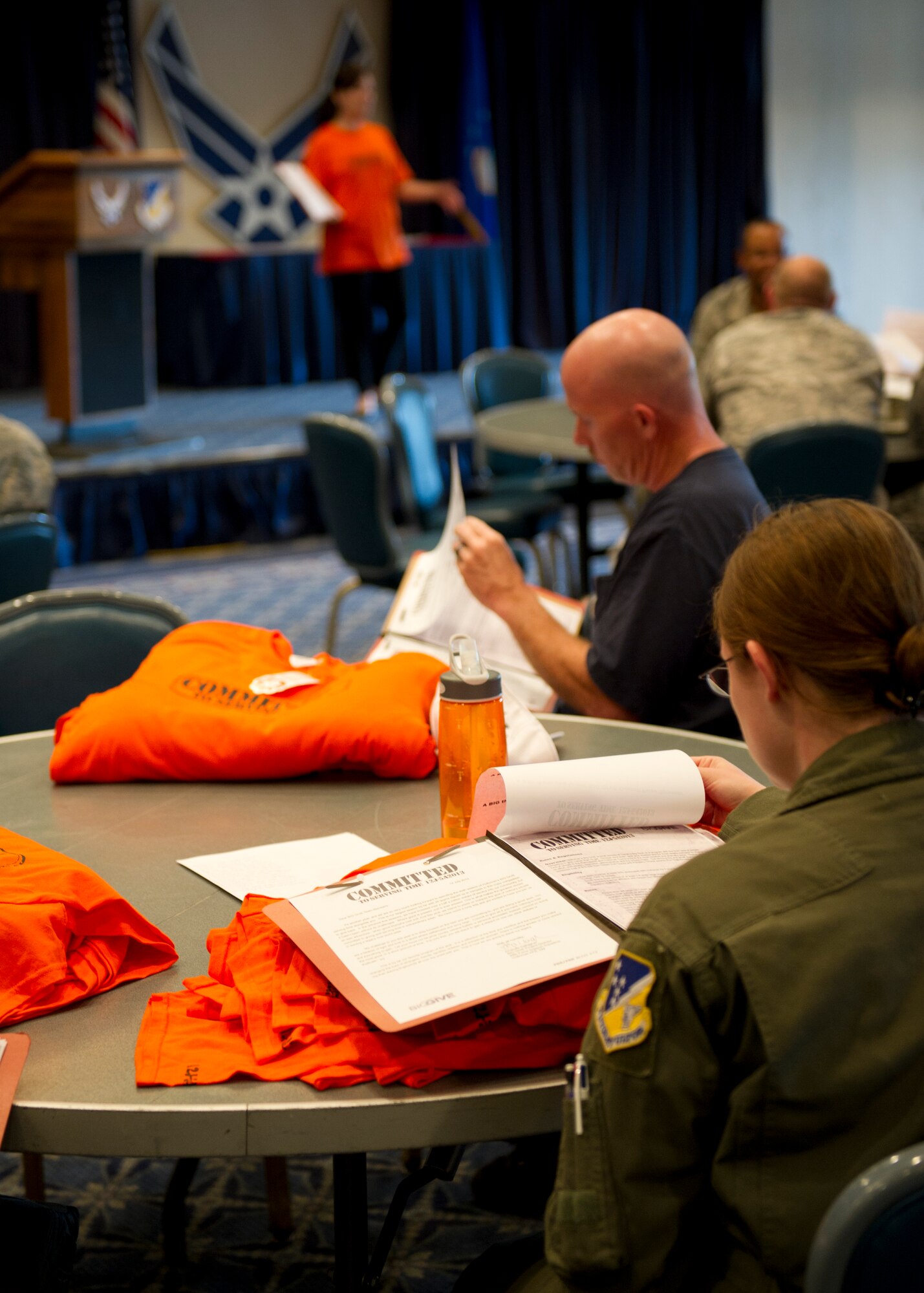 Teams review their information packets during the Big Give season six kick-off at Holloman Air Force Base, N.M., July 12. Their packets contained work logs, contact information, and contest rules. This year Holloman has 26 teams participating in the event, making it the biggest yet. (U.S. Air Force photo by Senior Airman Kasey Close/Released)