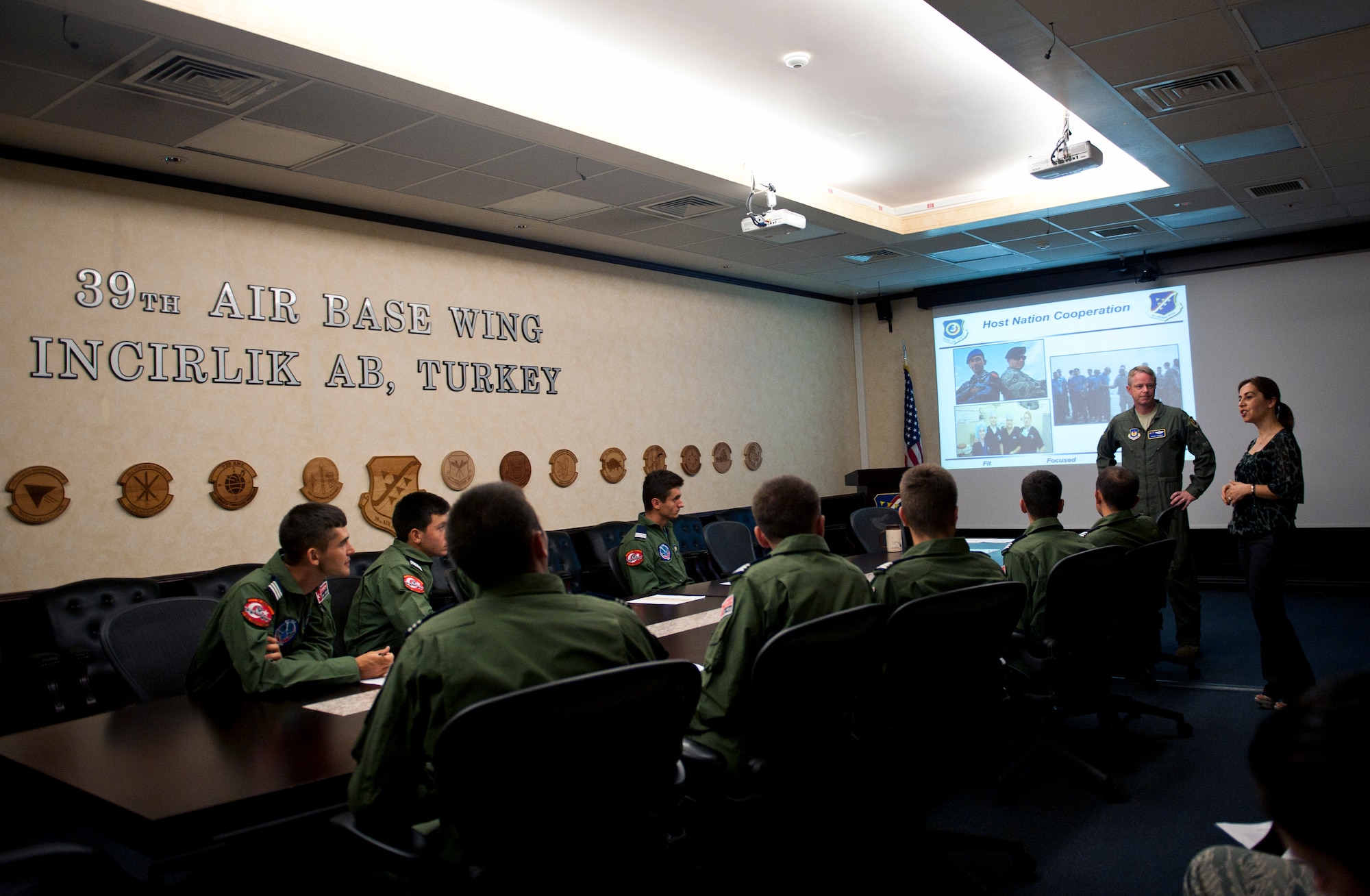 Col. Brent Bigger, 39th Air Base Wing vice commander, and Mina Smith, 39th Air ABW international affairs specialist, brief Turkish air force cadets on the mission of the 39th ABW July 15, 2013, at Incirlik Air Base, Turkey. The cadet tour provided opportunities to strengthen the solidarity between the two NATO allies. (U.S. Air Force photo by Senior Airman Daniel Phelps/Released)