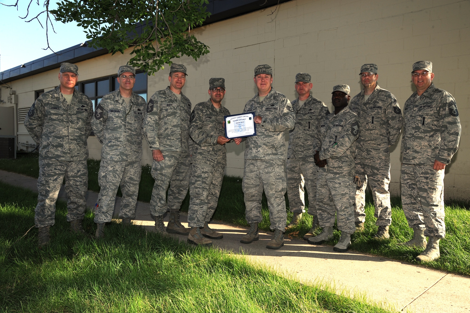 Staff Sgt. Steven Settersen, 5th Aircraft Maintenance Squadron, receives the Minot Chiefs' Group “Sharp Award” here July 11, 2013. Settersen’s acceptance was due to his keen knowledge of his duties and individual performance during recent inspections while saving money and time.  (U.S. Air Force photo/ Airman 1st Class Andrew Crawford)