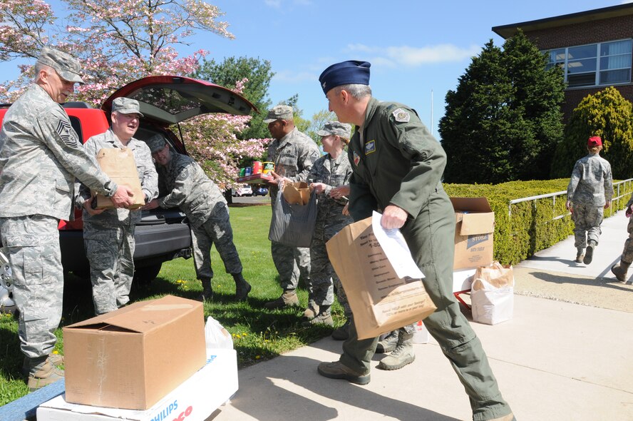 111th Fighter Wing Commander, Col. Howard Eissler 111th and Wing Command Chief, Chief Master Sgt. Richard Mertz joined the unit’s first sergeants in loading the bounty collected food after a two-month food drive sponsored at Horsham Air Guard Station, Horsham Pa. The estimated 50 bags were delivered to Horsham’s St. Catherine of Siena to support their food bank. The non-perishable food items will be distributed locally to families in need.