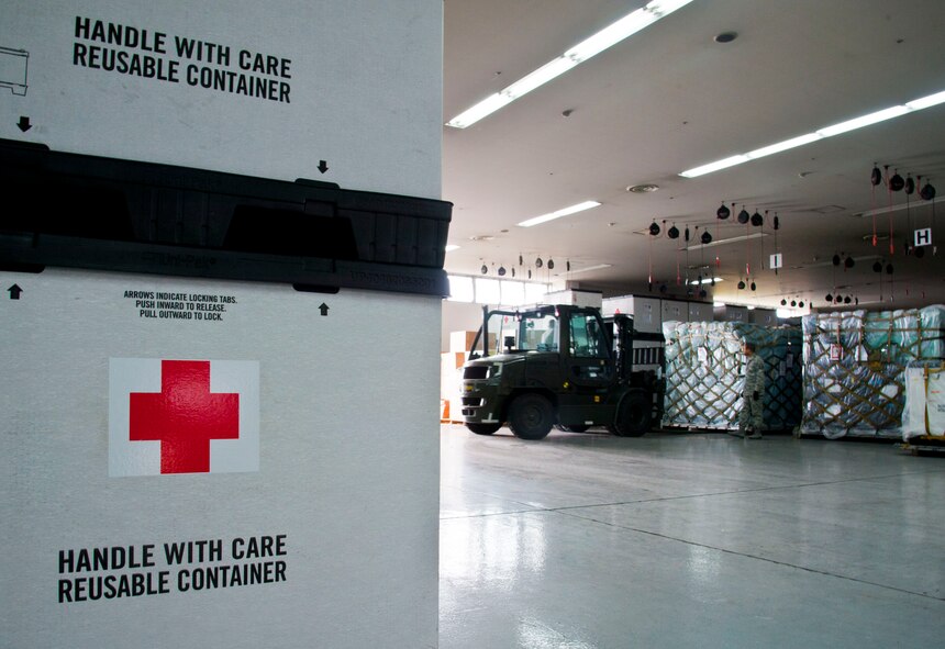 YOKOTA AIR BASE, Japan – Members of the 374th Medical Group moves the humanitarian supplies at Yokota Air Base, Japan, July 16, 2013.  The supplies ranged from typical medical supplies to generators and air conditioners.  (U.S. Air Force photo by Airman 1st Class Soo C. Kim)