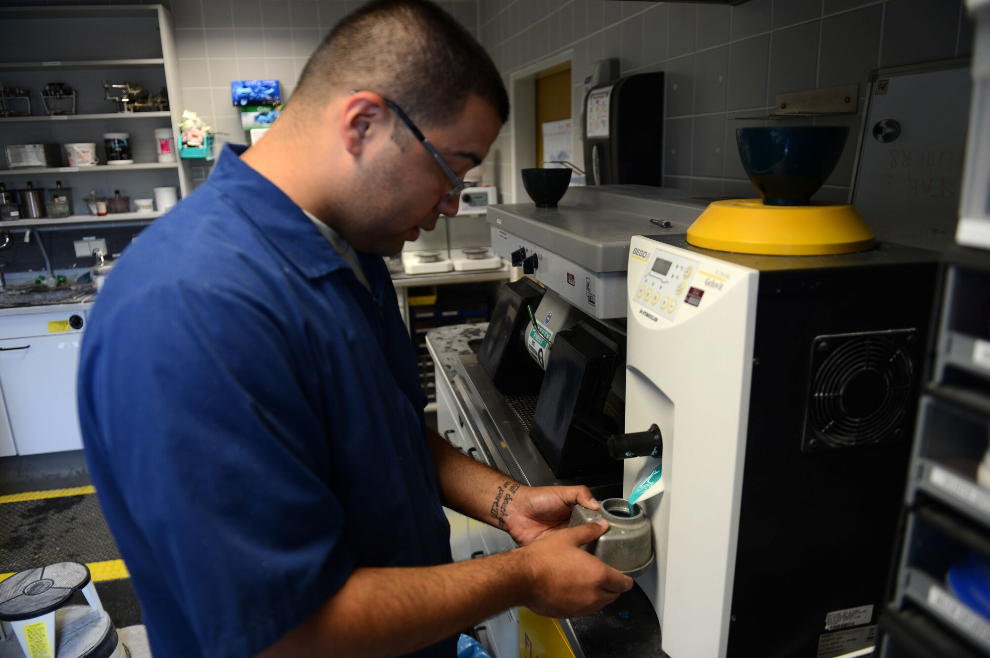 SPANGDAHLEM AIR BASE, Germany – U.S. Air Force Senior Airman Dennis Davila, 52nd Dental Squadron dental laboratory technician from New York, pours hydrocolloid liquid into a cast July 16, 2013. The liquid is used to create a mold of a patient’s mouth that a technician can work on without fear of destroying the original cast. (U.S. Air Force photo by Airman 1st Class Gustavo Castillo/Released) 