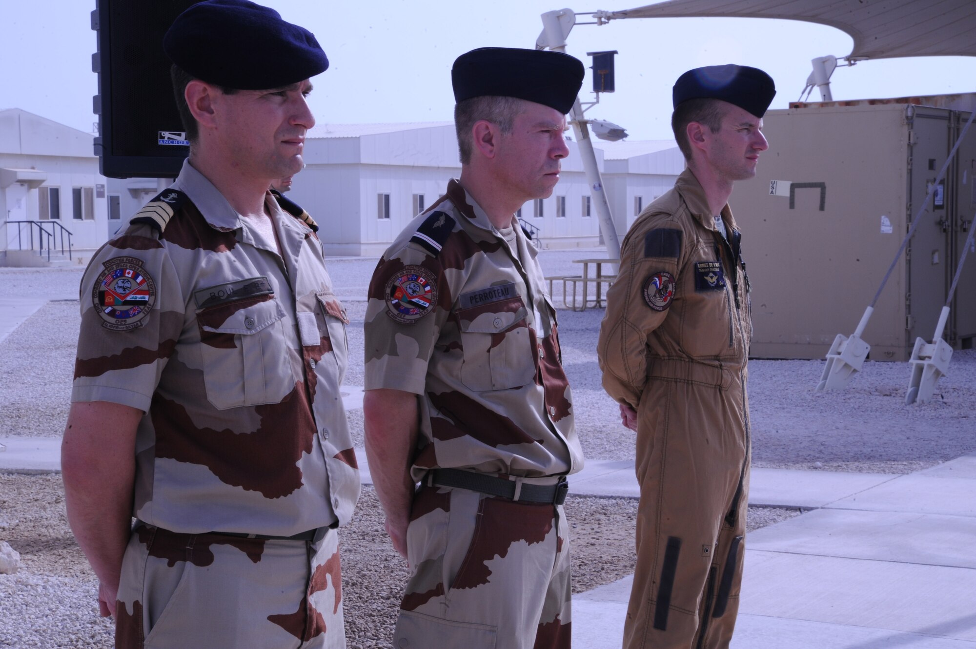 Three French Air Force service members stand at ease during a Bastille Day celebration at the 379th Air Expeditionary Wing in Southwest Asia, July 14, 2013. The taking of Bastille in 1789 signaled the beginning of the French Revolution. (U.S. Air Force photo/Senior Airman Bahja J. Jones) 