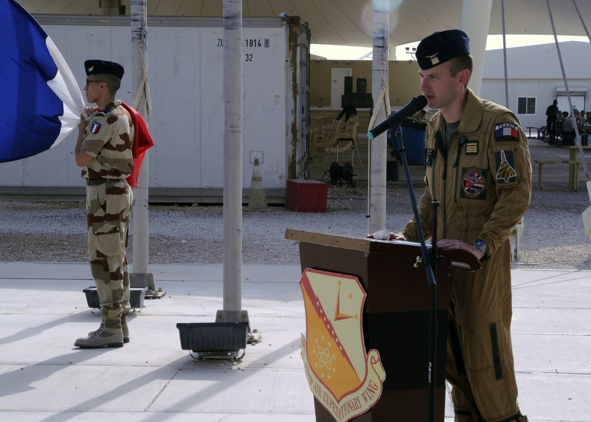 French Air Force Maj. Thibault Chazelle welcomes attendees to the Bastille Day ceremony at the 379th Air Expeditionary Wing in Southwest Asia, July 14, 2013. Bastille Day is holiday marking the anniversary of the fall of Bastille in Paris in 1789. Chazelle is assigned to the Combined Air and Space Operations Center French Detachment. (U.S. Air Force photo/Senior Airman Bahja J. Jones) 