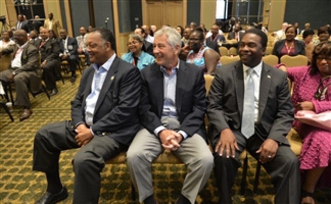 Secretary of Defense Chuck Hagel, center, takes a moment to sit with the Rev. Jesse Jackson, left, and Mayor Alvin Brown, right, of Jacksonville, Fla., during the Conference Of Minority Transportation Officials in Jacksonville, Fla., on July 16, 2013. Hagel met briefly with Jackson and Brown before leaving for a tour of Naval Air Station Jacksonville, Fla.  Hagel is visiting the Air Station to conduct town hall meetings and receive briefings from Navy and civilian leaders on the impact of furloughs and sequestration on their lives and operations.