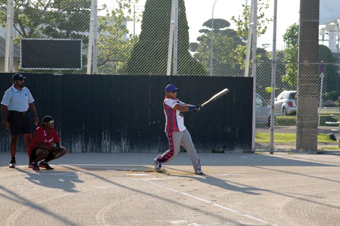 Mike Rodriguez, Reapers right fielder, hits the ball during an at bat against the White
Snakes at the softball field July 11, 2013. Though the Reapers took the win, the White
Snakes began to make a comeback in the 4th inning.