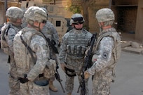 Army National Guard Command Sgt. Maj. John Gipe visits National Guard troops at an entry control point to the International Zone in Baghdad, Iraq, Oct. 17, 2008. "The National Guard is playing a vital role," Gipe said. "The Soldiers are doing a great job."