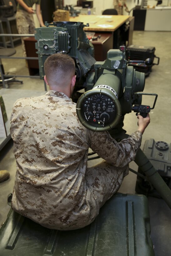 Lance Cpl. Cameron Pfeil, 1st Battalion, 6th Marine Regiment, 22nd Marine Expeditionary Unit optics technician and native of Mobile, Ala., performs a functions check on an M41 Saber missile system as part of their predeployment preparations and quarterly training in their armory at Marine Corps Base Camp Lejeune, July 15, 2013. The Saber system uses an optically-tracked and wire-guided anti-tank missile. (Marine Corps photo by Cpl. Manuel A. Estrada/Released)
