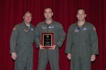 Lt. Col. Ed Vaughan (center) is inducted into the Air Force Safety Hall of Fame in a ceremony Feb. 6. With him are (left) Maj. Gen. Maury Forsyth, commander of the Spaatz Center at Maxwell Air Force Base, Ala., and Col. Marcus Quint, chief of the Air National Guard Safety Directorate.