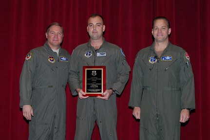 Lt. Col. Ed Vaughan (center) is inducted into the Air Force Safety Hall of Fame in a ceremony Feb. 6. With him are (left) Maj. Gen. Maury Forsyth, commander of the Spaatz Center at Maxwell Air Force Base, Ala., and Col. Marcus Quint, chief of the Air National Guard Safety Directorate.