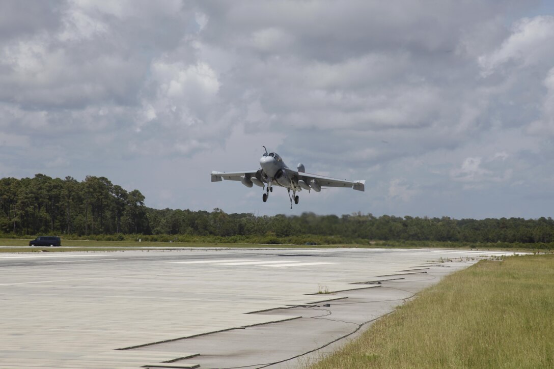 An EA-6B Prowler with Marine Tactical Electronic Warfare Training Squadron 1 comes in for a landing at Marine Corps Auxiliary Landing Field Bogue, N.C., July 11. Pilots were refereshing their skills in expeditionary airfield landings, which is landing on a short runway with the help of a tail hook and arresting gear.