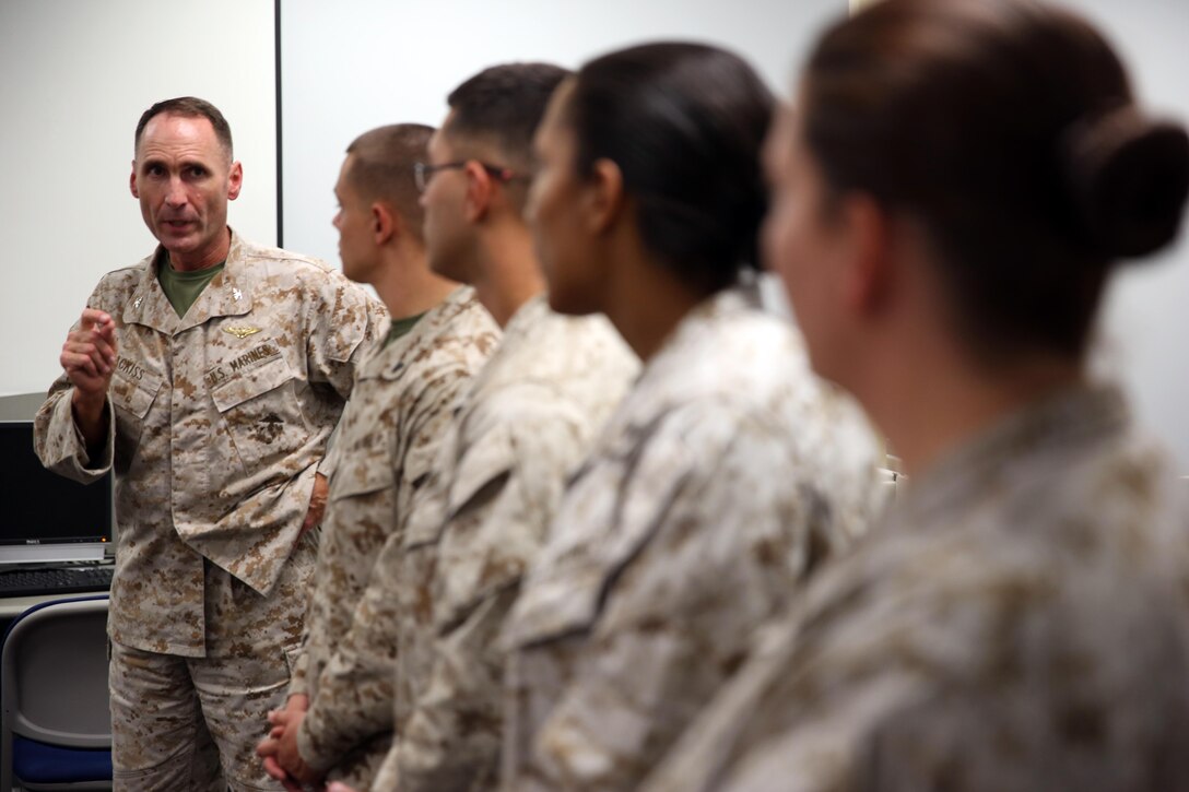 Col. Ernest L. Ackiss speaks to Marines on Cherry Point July 10 who recently earned Certified Logistics Associate and Certified Logistics Technician certificates. The program offers Marines the chance use job skills already acquired through their military occupational specialty to earn a certification recognized in the civilian sector. Ackiss is the Deputy Branch Head, Personal and Professional Development Branch, Headquarters, U.S. Marine Corps.