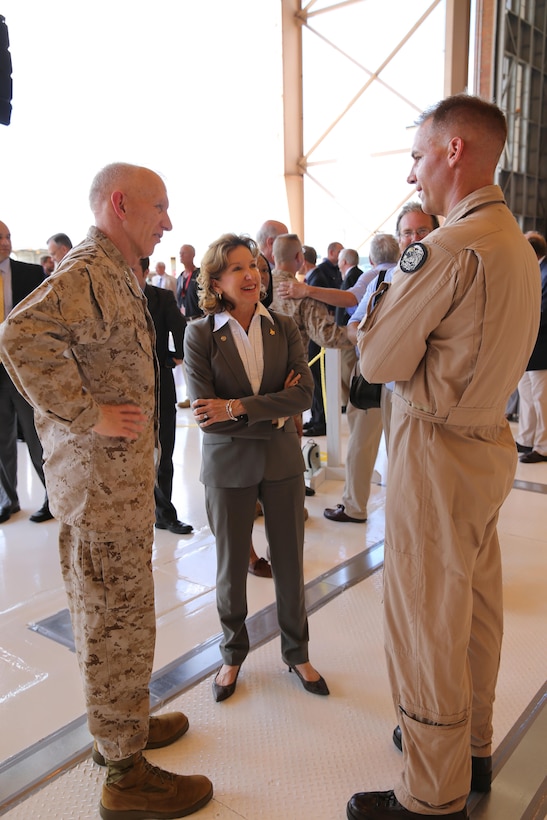 (From left to right) Lt. Gen. Robert E. Schmidle Jr., the deputy commandant for aviation, N.C. Senator Kay Hagan, and Lt. Col. Steve Gillette, a pilot attached to Marine Fighter Attack Training Squadron 501 who flew the first ever F-35B Lightning II to Cherry Point July 9, converse shortly after a ceremony for the arrival of the F-35B July 15 at the Fleet Readiness Center hangar.
