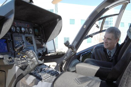 Bill Ryan, North American Aerospace Defense Command and U.S. Northern Command National Guard Special Staff, takes a look at the glass cockpit of a UH-72 Lakota helicopter during a demonstration and static display Jan. 24. Members of the Mississippi Army National Guard flew the UH-72 to Peterson AFB to educate members of NORAD and USNORTHCOM on possible applications for the aircraft. The UH-72 features an advanced glass cockpit and communications equipment and can be used for reconnaissance and security or medical evacuation missions. 
