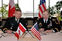 Canadian Forces Lieutenant-General Walter Semianiw, Canada Command commander (left) and Army Gen. Charles Jacoby, Jr., North American Aerospace Defense Command and U.S. Northern Command commander, sign military to military plans in Ottawa, Jan. 25, to enhance defense cooperation between Canada and the United States should the governments require each other's assistance. The documents signed were the Civil Assistance Plan, the Combined Defence Plan and an Information Sharing Memorandum of Understanding. Jacoby signed the CAP and the CDP in his capacity as the commander of USNORTHCOM and the MOU as the commander of NORAD and USNORTHCOM. The signings followed the 228th meeting of the Permanent Joint Board on Defence in Ottawa. 
