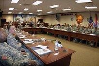 Army Maj. Gen. Charles Gailes (center), the commanding general of U.S. Army North’s Task Force 51, along with visiting dual-status commanders, listen to a command briefing Feb. 7 during the Dual Status Commanders Orientation at Army North’s Main Conference Room at the historic Quadrangle. Gailes hosted the briefing and provided the opening remarks. The one-day stop at Army North was part of a larger series of conferences conducted by U.S. Northern Command for commanders who serve in a combined federal-state position. 
