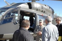 Chief Warrant Officer Joseph Mudd, National Guard Bureau, discusses the features of the UH-72 Lakota helicopter to members of the North American Aerospace Defense Command and U.S. Northern Command Jan. 24. Members of the Mississippi Army National Guard flew the UH-72 to Peterson AFB to educate members of NORAD and USNORTHCOM on possible applications for the aircraft. The UH-72 features an advanced glass cockpit and communications equipment and can be used for reconnaissance and security or medical evacuation missions. 

