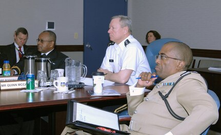 Royal Bahamas Defense Force commander Commodore Roderick Bowe, U.S. Northern Command Deputy Commander Lt. Gen. Frank Grass and Royal Bahamas Police Force Deputy Commissioner Quinn McCartney listen to a NORAD and USNORTHCOM orientation briefing at NORAD and USNORTHCOM headquarters Feb. 23. 
