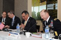 Secretary of Defense Leon Panetta and Army Gen. Charles H. Jacoby, Jr., NORAD and USNORTHCOM commander, talk during the Inaugural Trilateral Meeting of North American Defense Ministers March 27. 
