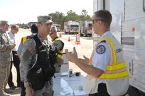 Colorado Army National Guard Lt. Col. Kevin Black, 8th Civil Support Team commander, gets a briefing on the current situation from the incident commander, Assistant Fire Chief Ken Helgersin, 10th Civil Engineer Squadron, during a Chemical, Biological, Radiological and Nuclear response exercise at the U.S. Air Force Academy May 3, 2012. U.S. Army North, a subordinate of U.S. Northern Command, is responsible for evaluating CSTs every 18 months. During CBRN incidents, the CST can support local emergency responders and will take direction from the local incident commander. 
