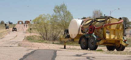 Members of the 8th Civil Support Team leave the safety of the decontaminated area May 3, 2012, and approach a chemical sprayer used in a simulated chemical attack on the U.S. Air Force Academy. The 8th CST members performed a reconnaissance of the area, taking air samples in an effort to determine the nature of the chemical used in the attack. U.S. Army North, a subordinate of U.S. Northern Command, is responsible for evaluating CSTs every 18 months. 
