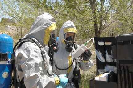 Colorado Army National Guard Sgts. Steve Russ and Ryan Betz check over their equipment before taking chemical samples from a sprayer during a Chemical, Biological, Radiological and Nuclear response exercise May 3 2012, at the U.S. Air Force Academy. The reconnaissance team will take samples of the chemical and bring it back to be examined in the 8th CST's mobile lab. U.S. Army North, a subordinate of U.S. Northern Command, is responsible for evaluating CSTs every 18 months. 
