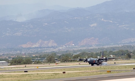 A MAFFS-equipped C-130 from the 153rd Airlift Wing of the Wyoming Air National Guard arrives at Peterson Air Force Base, Colo., June 25, to support wildfire fighting efforts in Colorado. The 153rd AW sent two aircraft equipped with Modular Airborne Fire Fighting Systems to join two from the 302nd Airlift Wing based at Peterson AFB for the effort. 

