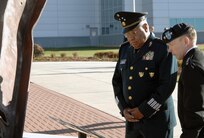 Army Gen. Charles H. Jacoby, Jr., NORAD and USNORTHCOM commander, and Gen. Guillermo Galvan Galvan, Secretary of National Defense, Mexico, pause at the NORAD and USNORTHCOM 9/11 Memorial upon arrival at the Eberhart-Findley Building Oct. 19. The commands flew the Mexican national flag in front of the headquarters building in honor of the general’s close relationship with USNORTHCOM. The two-day trip was Galvan’s last as Secretary of National Defense before he steps down from his position Dec. 1. As part of the visit, Galvan received a Modular Airborne Fire Fighting System demonstration from the 302nd Airlift Wing and visited with local community organizations. After speaking at a gathering of NORAD and USNORTHCOM members, honors were rendere d in front the headquarters, where Jacoby presented Galvan with an engraved artillery casing and the Mexican flag flown in front of the building. Galvan is credited with enhancing the partnership between SEDENA and USNORTHCOM which is essential in the fight against transnational criminal organizations. This partnership in the counter-TCO mission is one of USNORTHCOM’s top priorities, and the command is committed to working together with the Mexican military against TCOs. 
