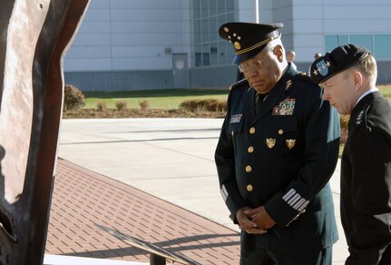 Army Gen. Charles H. Jacoby, Jr., NORAD and USNORTHCOM commander, and Gen. Guillermo Galvan Galvan, Secretary of National Defense, Mexico, pause at the NORAD and USNORTHCOM 9/11 Memorial upon arrival at the Eberhart-Findley Building Oct. 19. The commands flew the Mexican national flag in front of the headquarters building in honor of the general’s close relationship with USNORTHCOM. The two-day trip was Galvan’s last as Secretary of National Defense before he steps down from his position Dec. 1. As part of the visit, Galvan received a Modular Airborne Fire Fighting System demonstration from the 302nd Airlift Wing and visited with local community organizations. After speaking at a gathering of NORAD and USNORTHCOM members, honors were rendere d in front the headquarters, where Jacoby presented Galvan with an engraved artillery casing and the Mexican flag flown in front of the building. Galvan is credited with enhancing the partnership between SEDENA and USNORTHCOM which is essential in the fight against transnational criminal organizations. This partnership in the counter-TCO mission is one of USNORTHCOM’s top priorities, and the command is committed to working together with the Mexican military against TCOs. 
