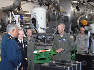 Air Force Lt. Col. Luke Thompson, 302nd Airlift Wing Chief of Aerial Fire Fighting, shows Gen. Guillermo Galvan Galvan, Secretary of National Defense, Mexico, a Modular Airborne Fire Fighting System during a tour of the 302nd AW Oct. 19. More than 30 members of the 302nd AW flew MAFFS missions to suppress a 245,000 acre wildfire in northern Mexico in 2011. The tour was part of Galvan’s last visit as Secretary of National Defense before he steps down from his position Dec. 1. As part of the visit, Galvan visited with local community organizations. After speaking at a gathering of NORAD and USNORTHCOM members, honors were rendered in front the headquarters, where Jacoby presented Galvan with an engraved artillery casing and the Mexican flag flown in front of the building. Galvan is credited with enhancing the partnership between SEDENA and USNORTHCOM which is essential in the fight against transnational criminal organizations. This partnership in the counter-TCO mission is one of USNORTHCOM’s top priorities, and the command is committed to working together with the Mexican military against TCOs. 
