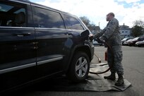 Tech. Sgt. Travis Wilcox, a ground fuels distribution specialist with the New York Air National Guard's 174th Attack Wing, distribute fuel at the Staten Island Armory, Saturday, Nov. 3, 2012, to those affected by Hurricane Sandy. The fuel, available at no charge to those who need it, was provided by the Federal Emergency Management Agency and distributed at various armories throughout the New York and northern New Jersey areas.  (U.S. Army Photo by Sgt. 1st Class Jon Soucy)(Released)