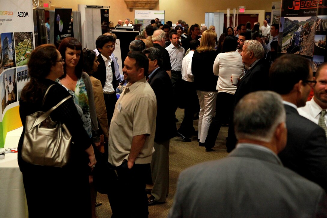 Sponsors, exhibitors and consultants fill the Del Mar room at the Pacific Views event center to view different booths and businesses during the “Camp Pendleton Day” event here July 18. The Society of American Military Engineers holds the annual “Camp Pendleton Day” event every year in support of the war fighter, specifically the engineering industry.