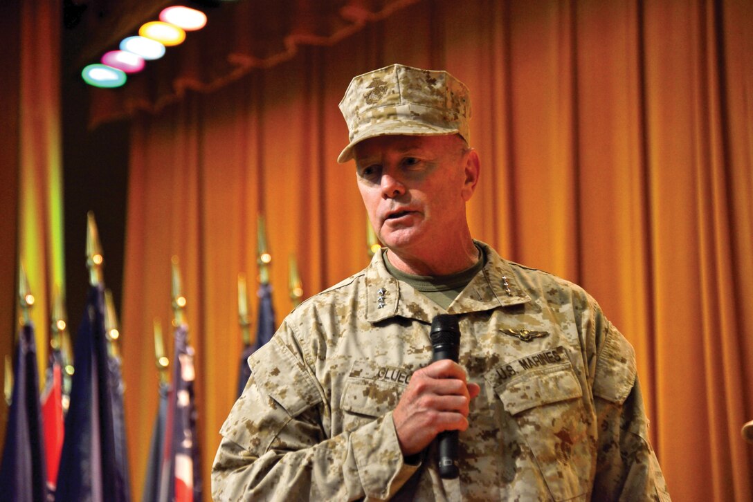 Lt. Gen. Kenneth J. Glueck Jr., addresses the crowd at the 3rd Marine Division change of command ceremony July 12 at the Camp Courtney Theater. During his address, Glueck, the outgoing commanding general of III Marine Expeditionary Force, recognized the central role of 3rd Marine Division in the MEF’s success and the vital role the division will play in the future. In a separate ceremony, Lt. Gen. John E. Wissler will assume command of III MEF from Glueck during the III MEF change of command ceremony July 19 at Camp Foster, concluding Glueck’s more than two and a half years of steadfast leadership in the region. Photo by Cpl. Mark W. Stroud