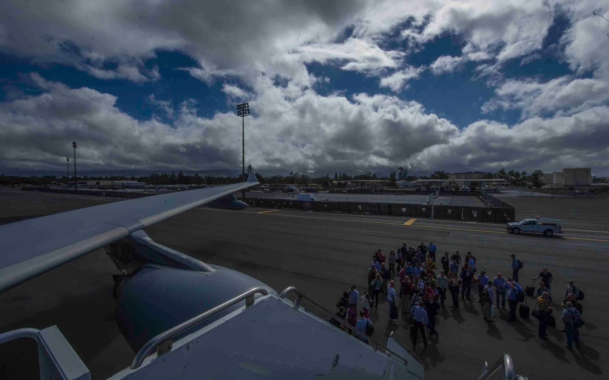 Australian civilians and members of the Royal Australian Air Force deplane a KC-30 July 12, 2013, at Joint Base Pearl Harbor-Hickam, Hawaii, after arriving to support Talisman Saber 2013. Talisman Saber is a U.S. led Australian supported exercise conducted primarily in Australia to improve combat training, readiness, and interoperability across a wide spectrum of military activities. (U.S. Air Force photo by Staff Sgt. Nathan Allen)