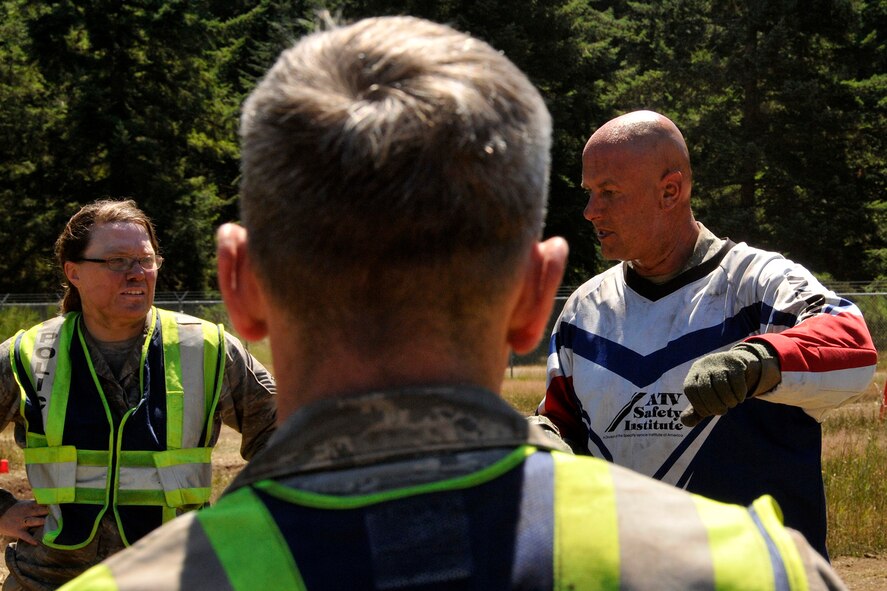 Master Sgt. Michael Pate (red, white, and blue instructor jersey), the 446th Security Forces Squadron NCO in charge of training, educates security forces Reservists on all-terrain-vehicle basic riding and safety, July 14. Pate is also the certified ATV instructor for the squadron. The ATV is one of the vehicles a security forces Airman might need in the field. For that reason, and because 446th SFS Reservists are deployable, they are required to take the ATV course every two to three years. Some of the 446th SFS Airmen have utilized those skills here at McChord Field to provide support for other security personnel, and incident response during major events, including air shows and Air Mobility Command Rodeo. (U.S. Air Force Reserve photo by Master Sgt. Jake Chappelle)
