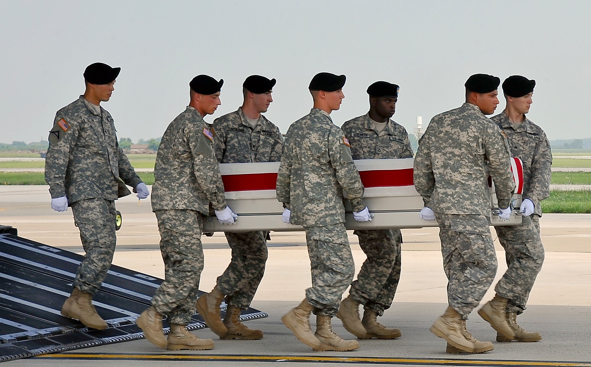 A U.S. Army carry team transfers the remains of Army Staff Sgt. Sonny C. Zimmerman of Waynesfield, Ohio, July 18, 2013, at Dover Air Force Base, Del.  Zimmerman was assigned to the 1st Battalion, 506th Infantry, 4 Brigade Combat Team, Fort Campbell, Ky. (U.S Air Force photo by Senior Airman Melanie Bulow-Kelly/Released)